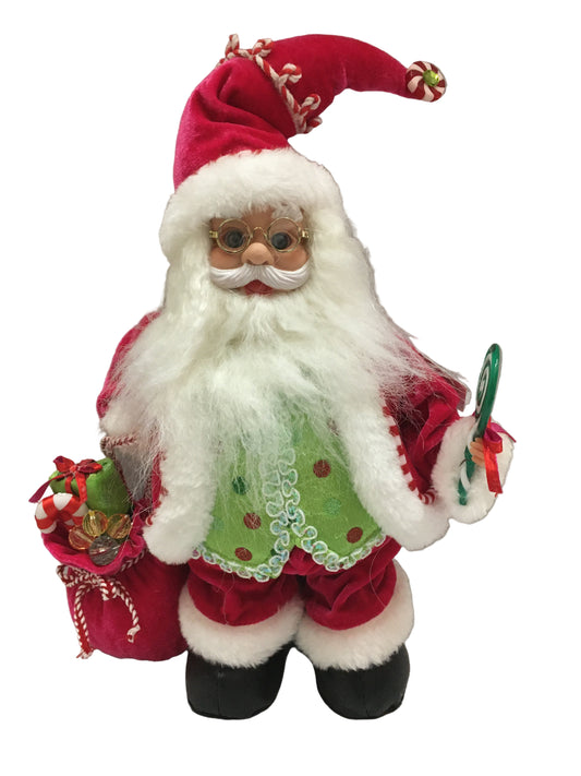 Decorative Santa Claus figure with a green apron on a plain background