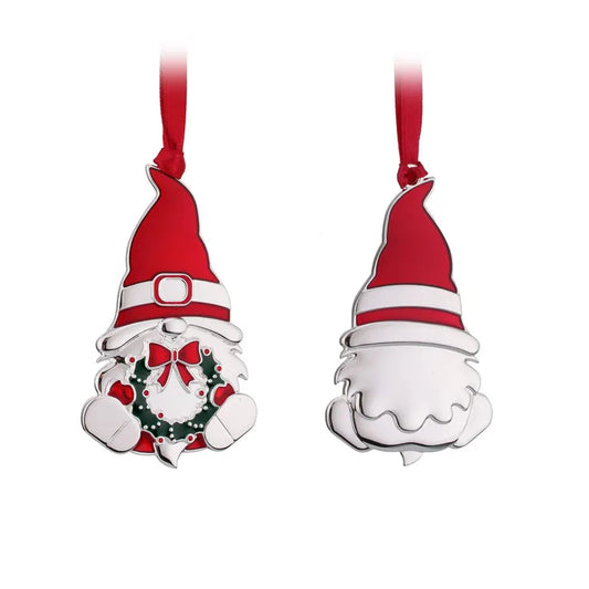 Two Christmas gnome ornaments with red hats on a white background