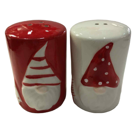 Two ceramic salt and pepper shakers with gnome designs on a white background